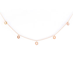 9ct gold necklace set with five daisies from Mark Whitehorn Goldsmith